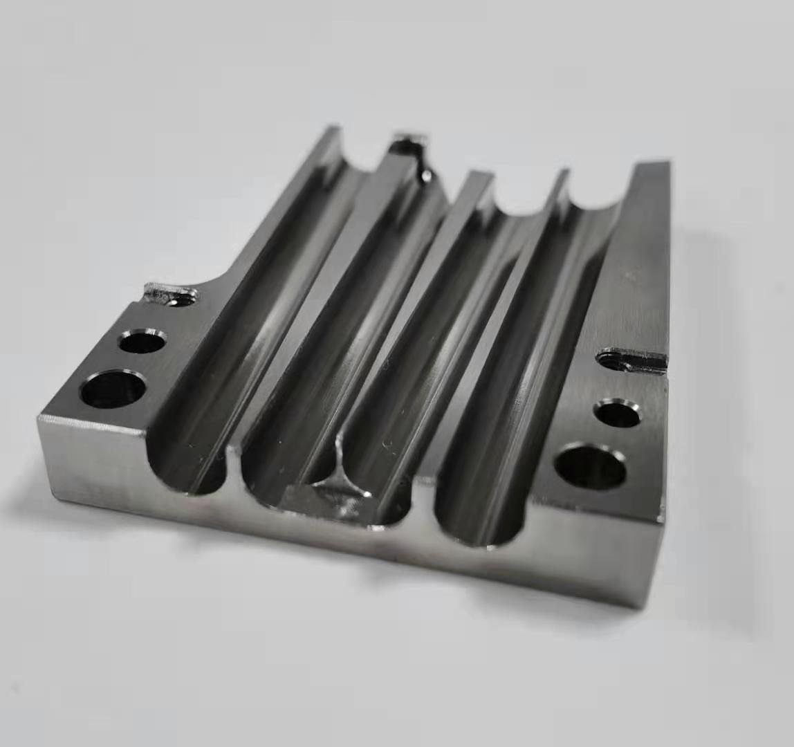 Precision CNC milled steel component with visible machined surfaces