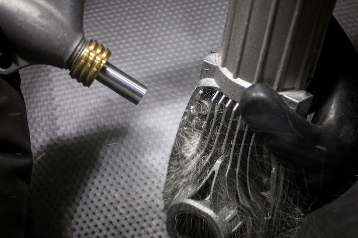A bead-blasted metal surface showing the characteristic uniform satin matte finish
