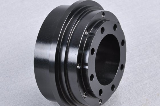 A precision CNC machined part with a black oxide coating finish