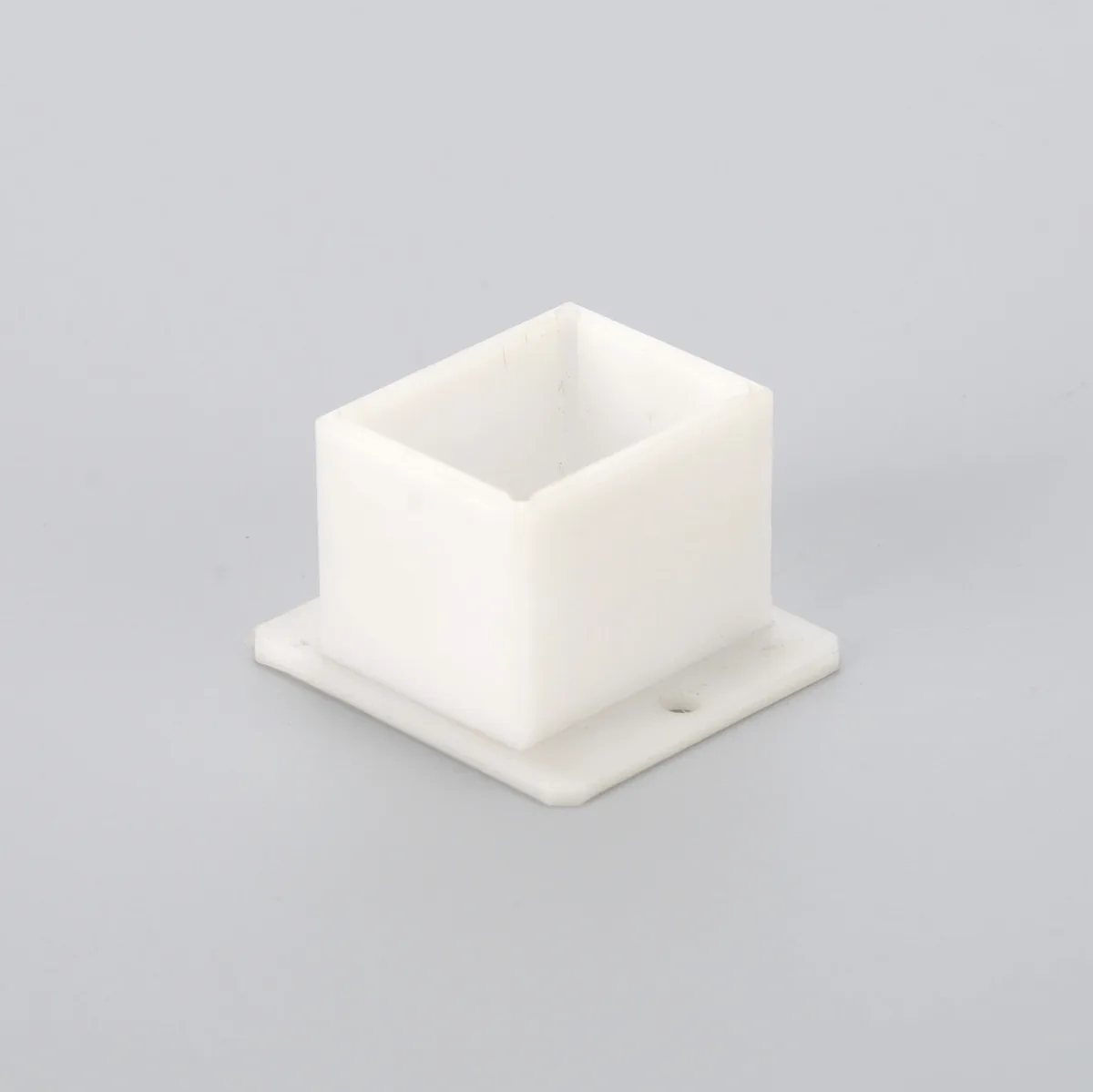 Representative white CNC machined fluoropolymer housing
